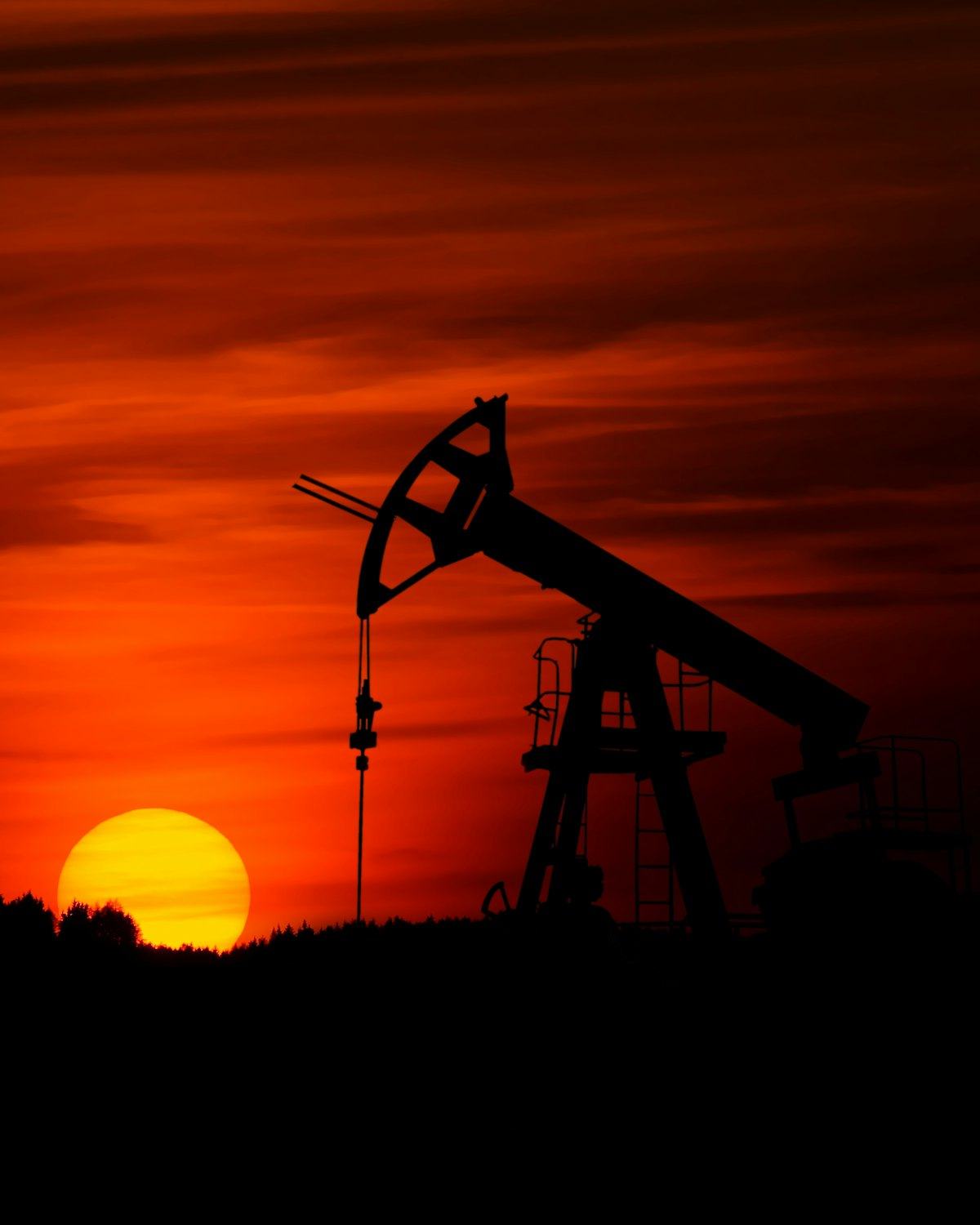 Oil pump jack at sunset