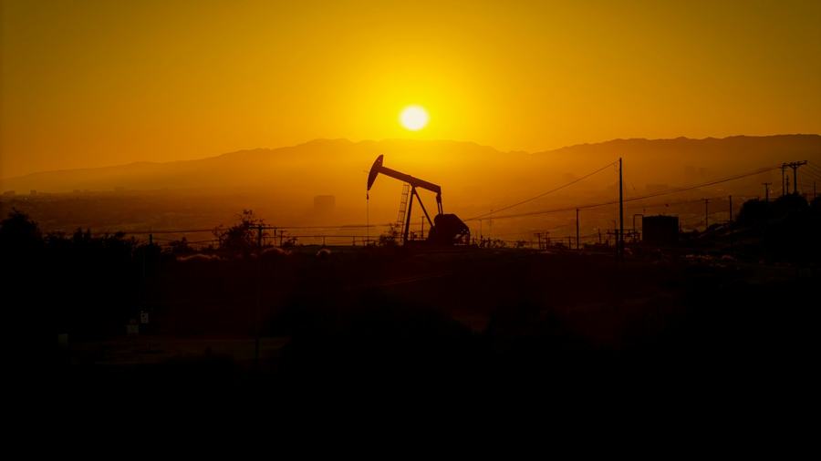 Oil pump jack at sunset